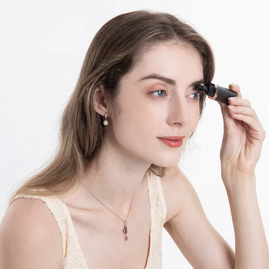 Electric Eyelash Curler in use